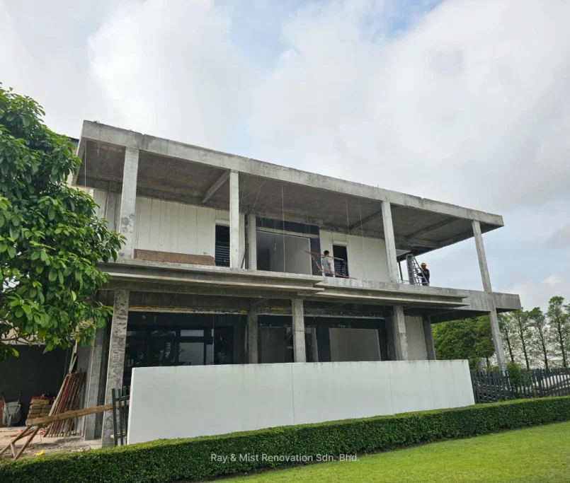 Ongoing double-storey house renovation with workers on the roof —Project by Ray & Mist Renovation Sdn. Bhd.