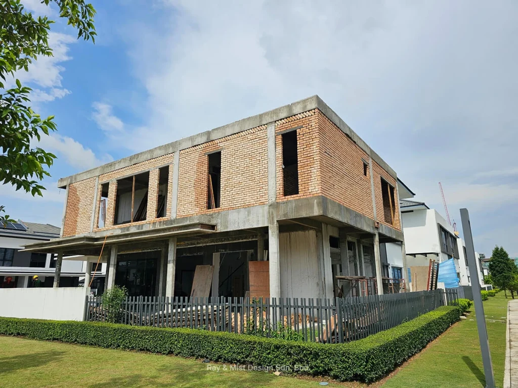 Corner angle of a two-storey red brick building under construction —Project by Ray & Mist Renovation Sdn. Bhd.