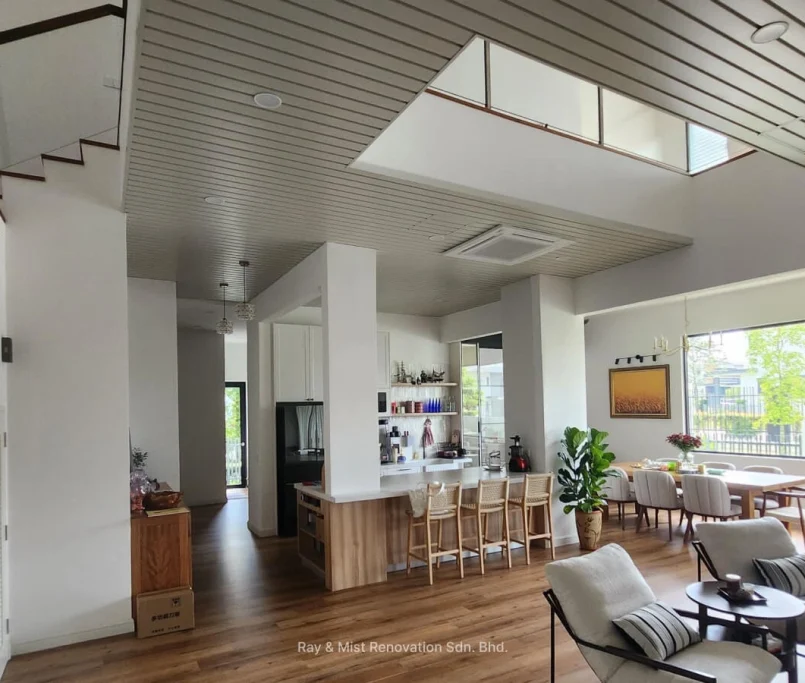 Open-plan living, dining, and kitchen area with timber flooring and modern finishes —Project by Ray & Mist Renovation Sdn. Bhd.