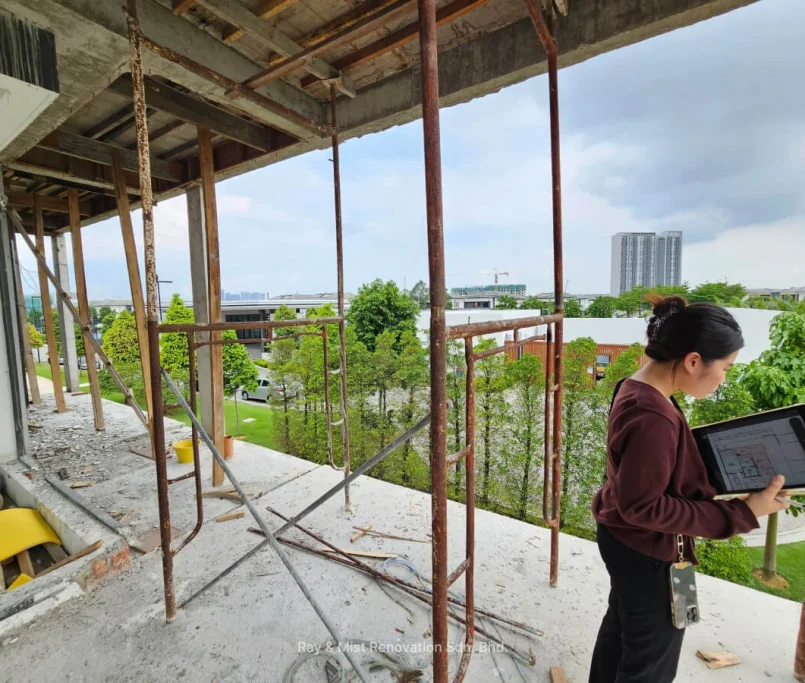 Site inspection in progress on a partially constructed upper floor with exposed beams —Project by Ray & Mist Renovation Sdn. Bhd.