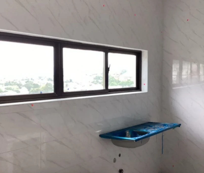 Kitchen under installation with marble tile wall and boxed appliances —Project by Ray & Mist Design Sdn. Bhd.
