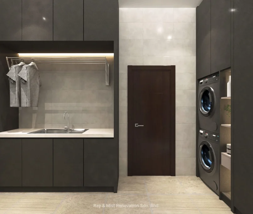 Modern built-in laundry and utility room with dark cabinetry, double stainless steel sink, and stacked washer dryer unit — Project by Ray & Mist Renovation Sdn. Bhd.
