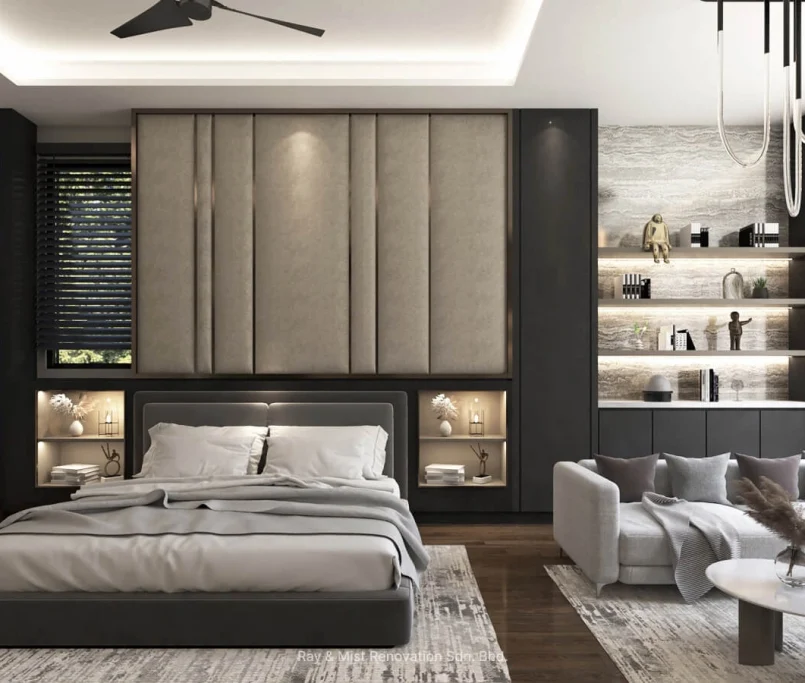 Modern master bedroom with full-height padded headboard, integrated side shelving, and a cosy lounge corner — Project by Ray & Mist Renovation Sdn. Bhd.