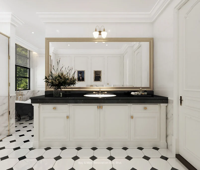 White bathroom vanity with black countertop, gold fixtures, and large framed mirror —Project by Ray & Mist Renovation Sdn. Bhd.