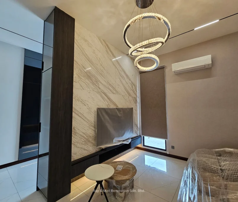 Modern living area with marble feature wall, concealed TV unit, and circular LED pendant lights —Project by Ray & Mist Design Sdn. Bhd.