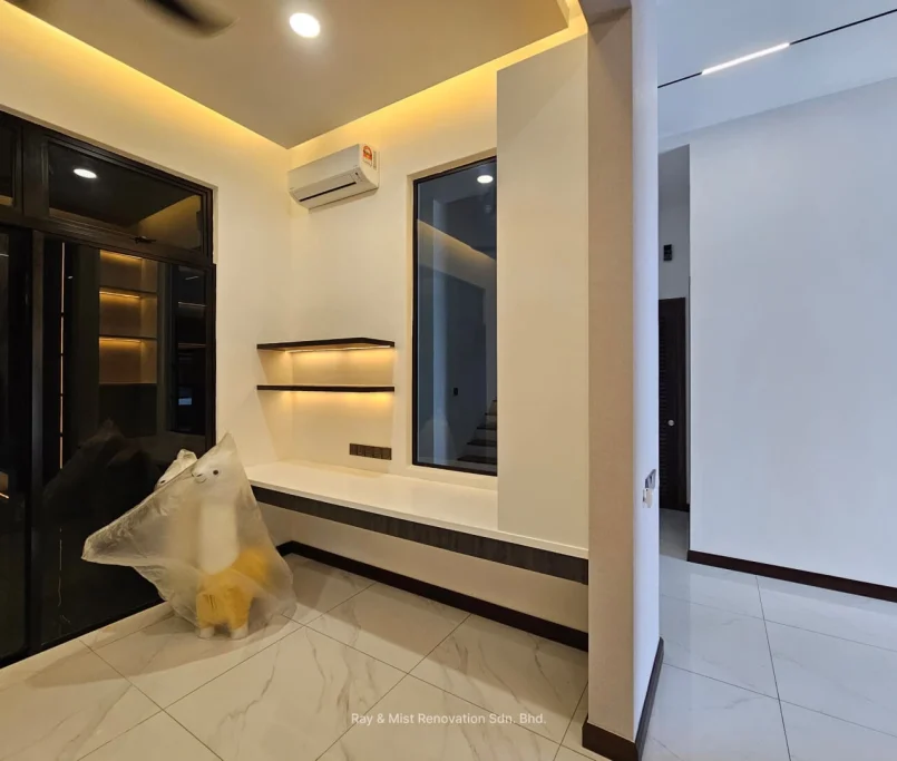 Minimalist corner seating area with floating shelves, ambient lighting, and air conditioning —Project by Ray & Mist Design Sdn. Bhd.