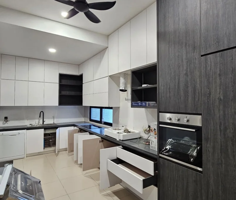 Modern kitchen with black and white cabinets, open drawers, and built-in oven —Project by Ray & Mist Design Sdn. Bhd.