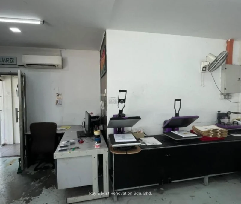 Small workspace with heat press machines, computer desks, and wall fan — Project by Ray & Mist Renovation Sdn. Bhd.