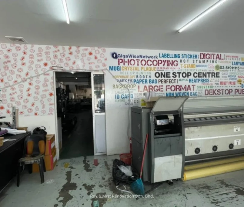 Large format printing workspace with promotional wall graphics and wide printer machine —Project by Ray & Mist Renovation Sdn. Bhd.