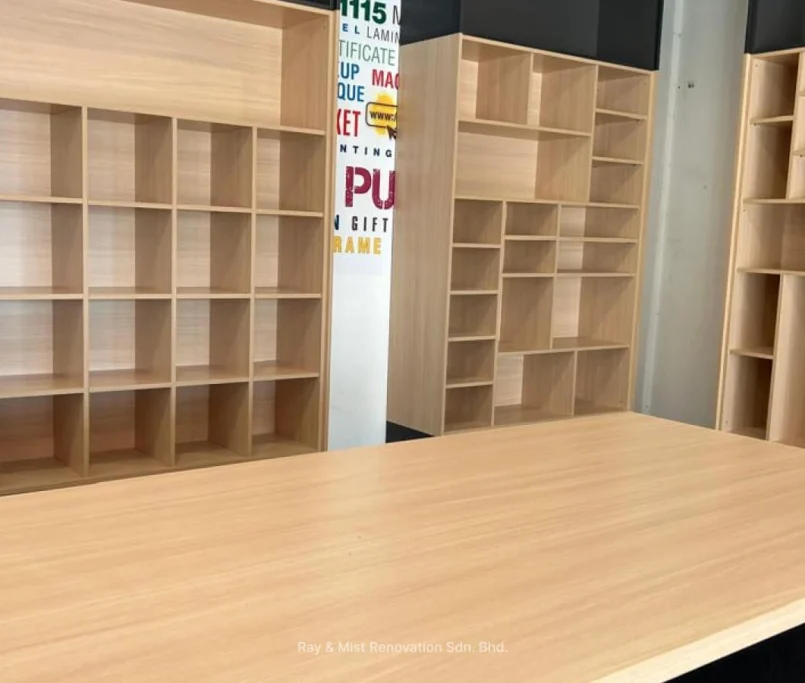 Close-up view of newly installed custom open shelving with a matching countertop —Project by Ray & Mist Renovation Sdn. Bhd.