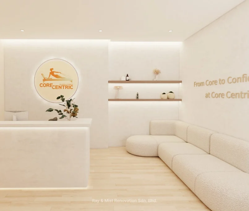 Corecentric Pilates studio reception lounge with curved cream sofa, floating shelves, and illuminated logo — Project by Ray & Mist Renovation Sdn. Bhd.