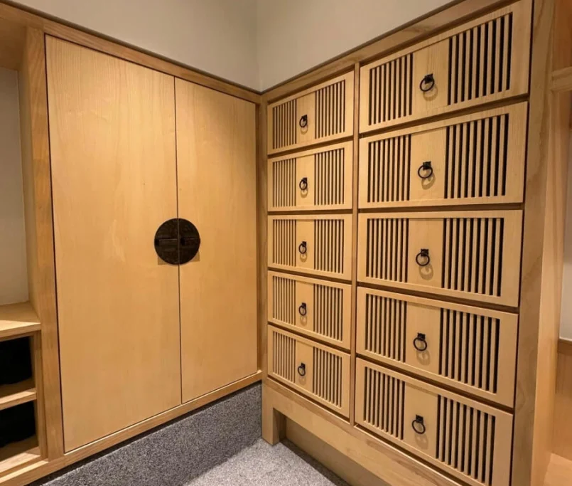 Japanese-style wooden storage cabinets with vertical slatted drawer fronts and a pair of large panel doors —Project by Ray & Mist Design Sdn. Bhd.