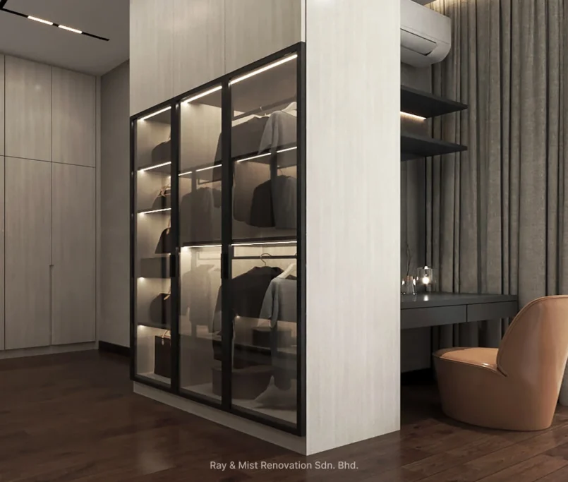 Glass wardrobe with interior lighting, built-in vanity with taupe chair, and full-length curtains — Project by Ray & Mist Renovation Sdn. Bhd.