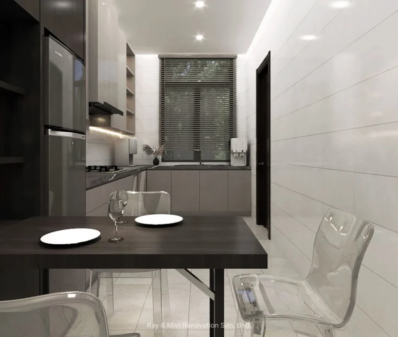 Compact dining space within a modern kitchen, featuring fold-out table, acrylic chairs, and minimalist cabinetry — Project by Ray & Mist Renovation Sdn. Bhd.