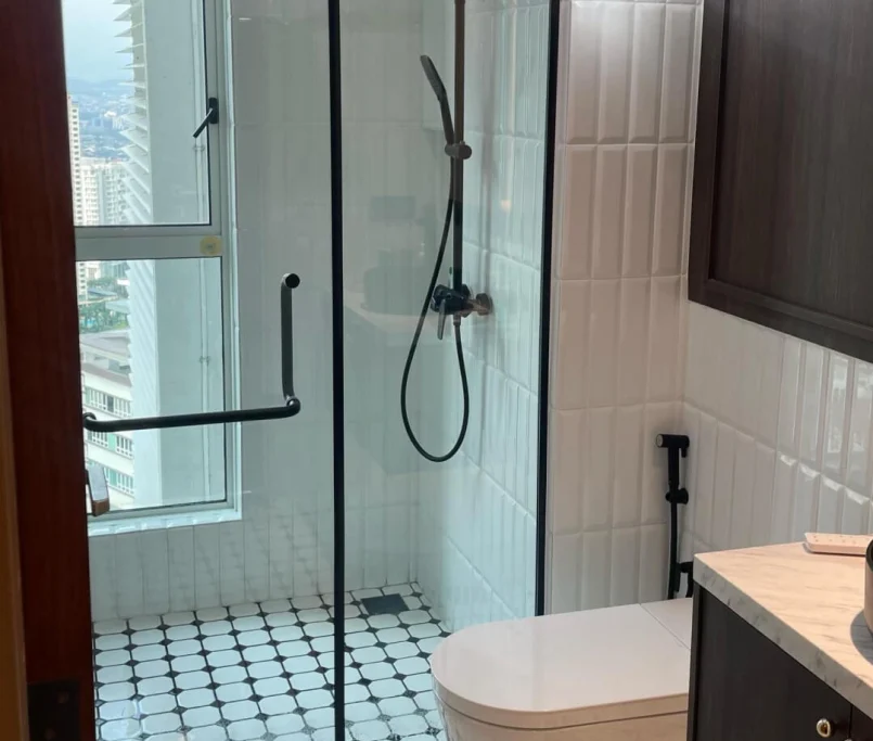 Modern bathroom with glass shower enclosure, patterned floor tiles, and pendant lights — Project by Ray & Mist Renovation Sdn. Bhd.