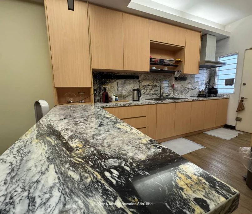 Modern kitchen with natural wood cabinetry and bold marble countertop — Project by Ray & Mist Design Sdn. Bhd.