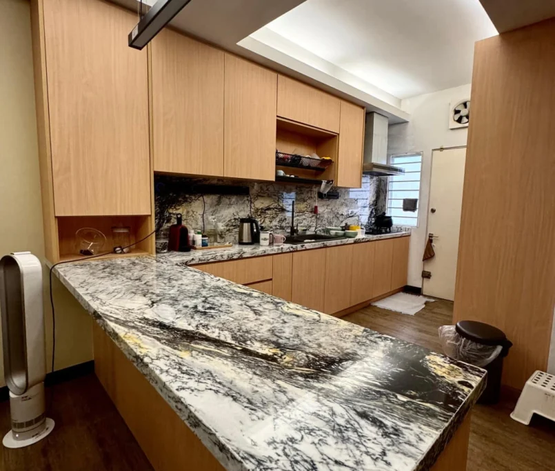 Contemporary kitchen with bold marble island and warm wood cabinets — Project by Ray & Mist Design Sdn. Bhd.